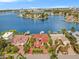 Waterfront community showing a house with red tile roof and red brick driveway at 1818 Dolphin S Blvd, St Petersburg, FL 33707