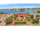 Luxury waterfront home with red tile roof and circular driveway at 1818 Dolphin S Blvd, St Petersburg, FL 33707