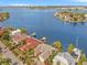 Waterfront property with private dock, boat, and lush landscaping, near other homes at 1818 Dolphin S Blvd, St Petersburg, FL 33707