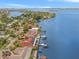 Waterfront home with private dock and boat, surrounded by tropical landscaping at 1818 Dolphin S Blvd, St Petersburg, FL 33707