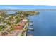 Aerial view of waterfront home with solar panels and private boat dock at 1818 Dolphin S Blvd, St Petersburg, FL 33707