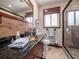 Bathroom with copper sink, walk-in shower, and tile flooring at 1818 Dolphin S Blvd, St Petersburg, FL 33707