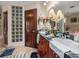 Double vanity bathroom with glass block feature wall at 1818 Dolphin S Blvd, St Petersburg, FL 33707