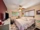 Relaxing bedroom with a king-size bed and accent wall at 1818 Dolphin S Blvd, St Petersburg, FL 33707