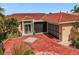 House exterior with red tile roof and brick driveway at 1818 Dolphin S Blvd, St Petersburg, FL 33707