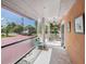 Enclosed front porch with tiled floor and screened windows at 1818 Dolphin S Blvd, St Petersburg, FL 33707