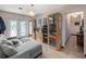 Bright living room featuring a sectional sofa and access to backyard at 1818 Dolphin S Blvd, St Petersburg, FL 33707