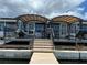 Expansive waterfront patio with two pergolas and seating areas at 1818 Dolphin S Blvd, St Petersburg, FL 33707