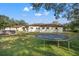 Large backyard with trampoline and grassy area at 18801 Orange Hill Dr, Hudson, FL 34667