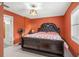 Spacious bedroom with king-size bed and large window at 18801 Orange Hill Dr, Hudson, FL 34667
