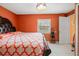 Bright bedroom with king-size bed and ample closet space at 18801 Orange Hill Dr, Hudson, FL 34667