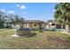 View of the house's backyard with a stone-edged pool at 18801 Orange Hill Dr, Hudson, FL 34667