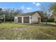 Spacious three-car garage with extra space at 18801 Orange Hill Dr, Hudson, FL 34667