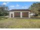 Detached two-car garage with ample storage at 18801 Orange Hill Dr, Hudson, FL 34667