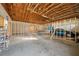 Unfinished garage with high ceilings and potential for workshop at 18801 Orange Hill Dr, Hudson, FL 34667