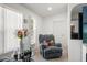 Cozy living room featuring a recliner and large window at 18801 Orange Hill Dr, Hudson, FL 34667