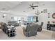 Living room with gray leather furniture and a large screen TV at 18801 Orange Hill Dr, Hudson, FL 34667