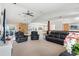Spacious living room with leather recliners and a stone fireplace at 18801 Orange Hill Dr, Hudson, FL 34667