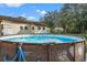 Above ground pool in backyard setting at 18801 Orange Hill Dr, Hudson, FL 34667