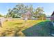 Large backyard with a shed and a spacious grassy area at 21 Belle Meade Cir, Largo, FL 33770