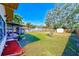 Large backyard with screened patio, shed, and plenty of grass space at 21 Belle Meade Cir, Largo, FL 33770