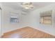 Bright bedroom with hardwood floors and two windows at 21 Belle Meade Cir, Largo, FL 33770