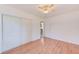 Bedroom with hardwood floors and mirrored closet doors at 21 Belle Meade Cir, Largo, FL 33770