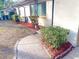 Landscaped front yard with walkway leading to the entrance at 21 Belle Meade Cir, Largo, FL 33770