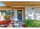 House exterior featuring a classic front door and landscaping at 21 Belle Meade Cir, Largo, FL 33770