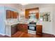 Updated kitchen with granite countertops and dark wood cabinets at 21 Belle Meade Cir, Largo, FL 33770