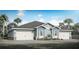 Two-story home with gray roof, blue siding, and a three-car garage at 2569 Mario Way, Clearwater, FL 33761
