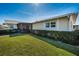 Landscaped backyard with screened patio and grass at 2820 Highlands Blvd # A, Palm Harbor, FL 34684