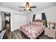 Charming bedroom with a full-size bed and ceiling fan at 2820 Highlands Blvd # A, Palm Harbor, FL 34684