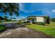 Andover Village clubhouse with lush landscaping at 2820 Highlands Blvd # A, Palm Harbor, FL 34684