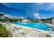 Inviting community pool with lounge chairs, ready for relaxation at 2820 Highlands Blvd # A, Palm Harbor, FL 34684