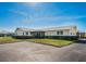 Tan single story home with carport and well-manicured lawn at 2820 Highlands Blvd # A, Palm Harbor, FL 34684