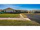 Tan single story home with paved driveway and green lawn at 2820 Highlands Blvd # A, Palm Harbor, FL 34684