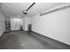 Attached garage with washer, dryer, and storage shelves at 2820 Highlands Blvd # A, Palm Harbor, FL 34684