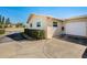 White garage door and side yard with shrubs at 2820 Highlands Blvd # A, Palm Harbor, FL 34684