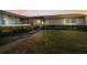 Charming house exterior with a screened porch and landscaping at 2820 Highlands Blvd # A, Palm Harbor, FL 34684