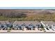 Row of townhouses viewed from above, showcasing community layout at 32241 Turtle Grace Loop, Wesley Chapel, FL 33545
