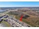 Aerial view of townhomes near a pond at 32241 Turtle Grace Loop, Wesley Chapel, FL 33545