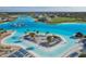 Drone view of the community lagoon, beach, and homes at 32241 Turtle Grace Loop, Wesley Chapel, FL 33545