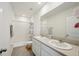 Bathroom with double vanity, shower, and toilet at 32241 Turtle Grace Loop, Wesley Chapel, FL 33545