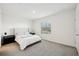 Spacious bedroom with queen bed and window at 32241 Turtle Grace Loop, Wesley Chapel, FL 33545