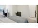 Main bedroom with a workspace and a bed at 32241 Turtle Grace Loop, Wesley Chapel, FL 33545