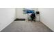 Spacious bedroom with carpeted floor, a desk and a treadmill at 32241 Turtle Grace Loop, Wesley Chapel, FL 33545