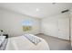 Bright bedroom with double bed and window at 32241 Turtle Grace Loop, Wesley Chapel, FL 33545