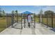 Gated dog park entrance with shaded seating area at 32241 Turtle Grace Loop, Wesley Chapel, FL 33545