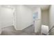 Upstairs hallway with carpet flooring, leading to bedrooms and stairs at 32241 Turtle Grace Loop, Wesley Chapel, FL 33545